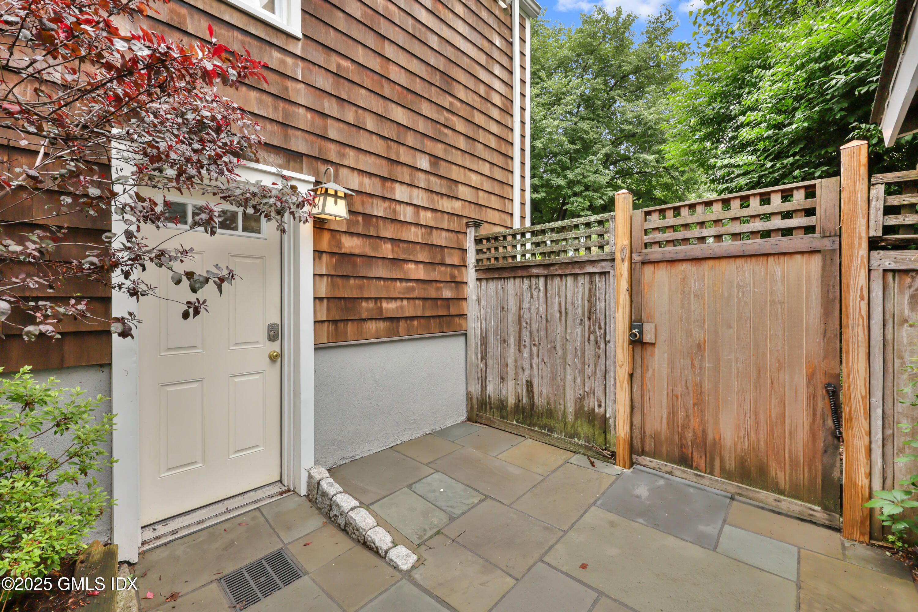 3 Janet Court, Unit 2 Riverside, CT 06878 - Photo 2 of 22 a view of a wooden door and outdoor space