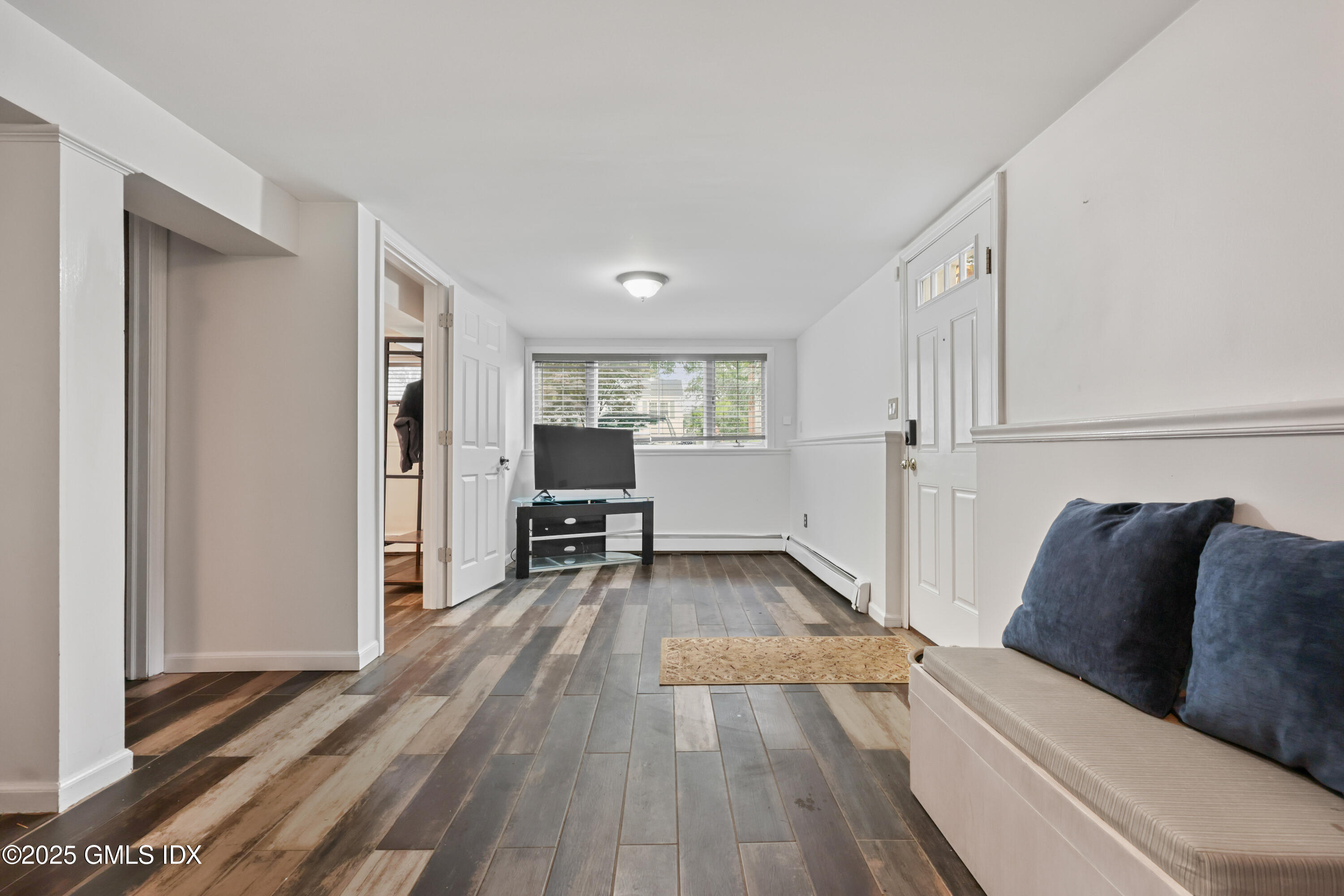 3 Janet Court, Unit 2 Riverside, CT 06878 - Photo 6 of 22 a living room with furniture and a wooden floor