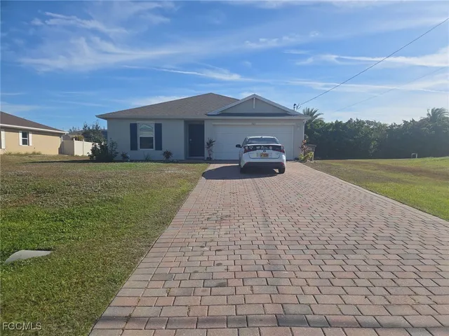 a house view with a garden space