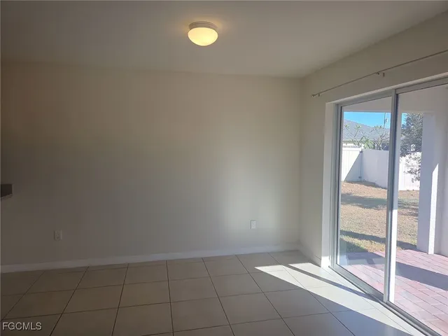 a view of an empty room and window