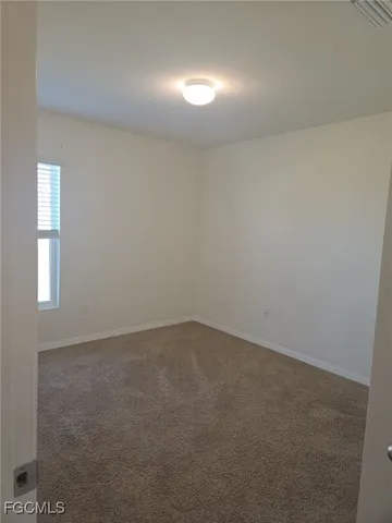 an empty room with a empty space and window