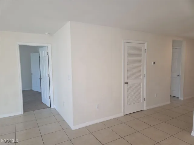 a view of an empty room and window