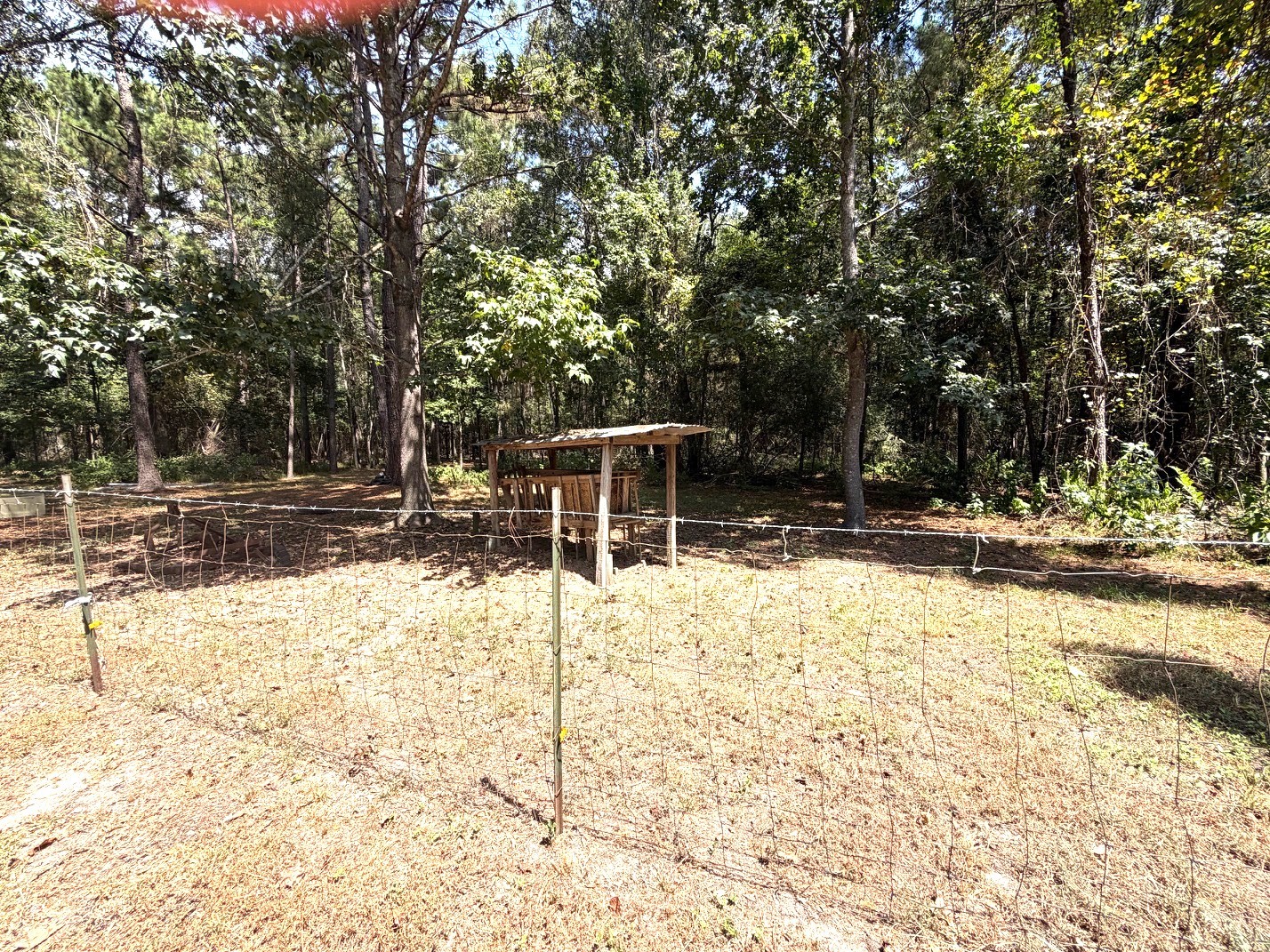 3080 Lee Turner Road Cleveland, TX 77328 - Photo 44 of 48 Enjoy the possibilities of this spacious fenced area, ideal for animals, gardening, or creating your own homestead retreat.