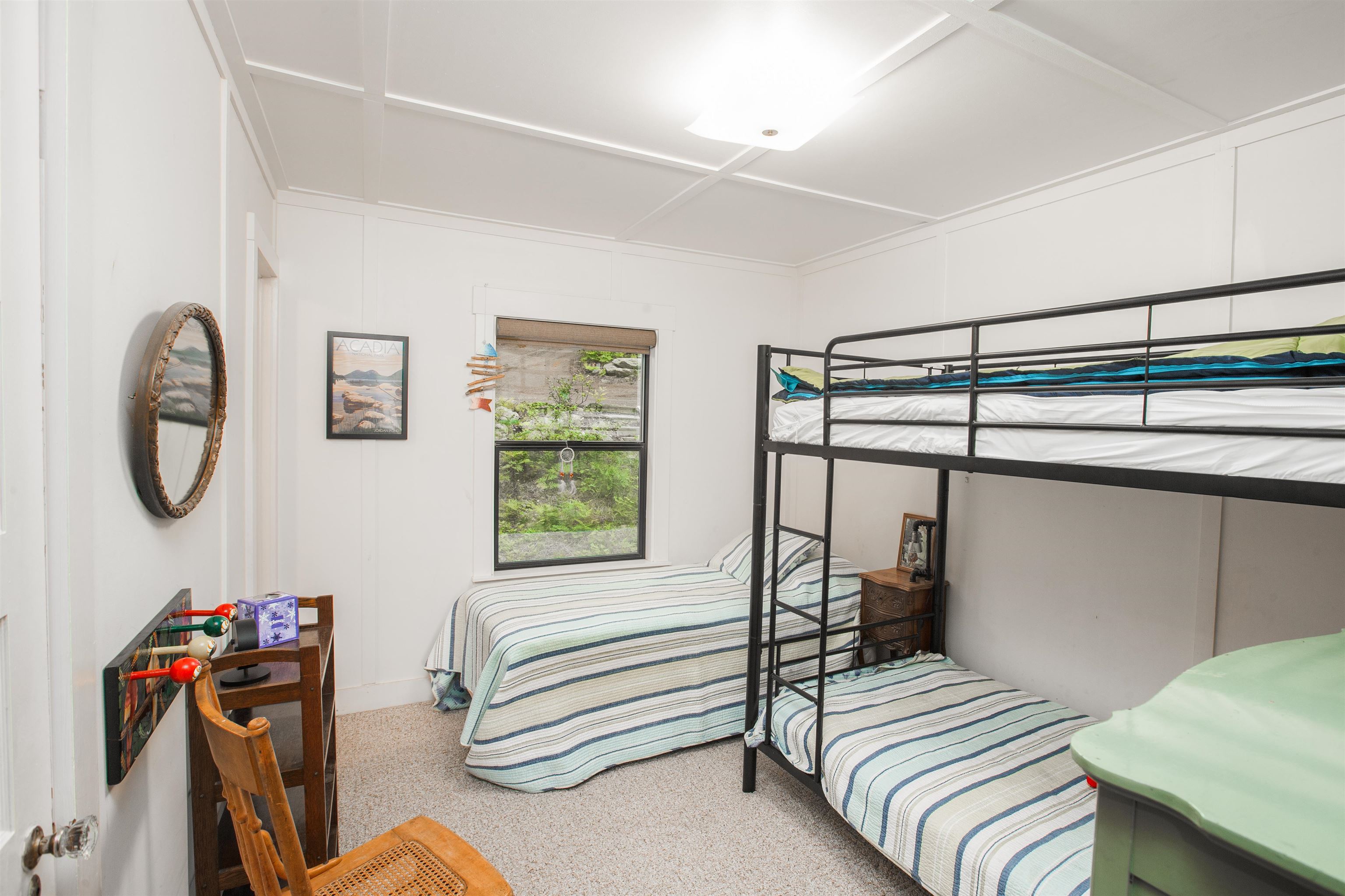278 Mile High Road Quincy, CA 95971 - Photo 21 of 38 a bedroom with a bed a standing fan and a bookshelf