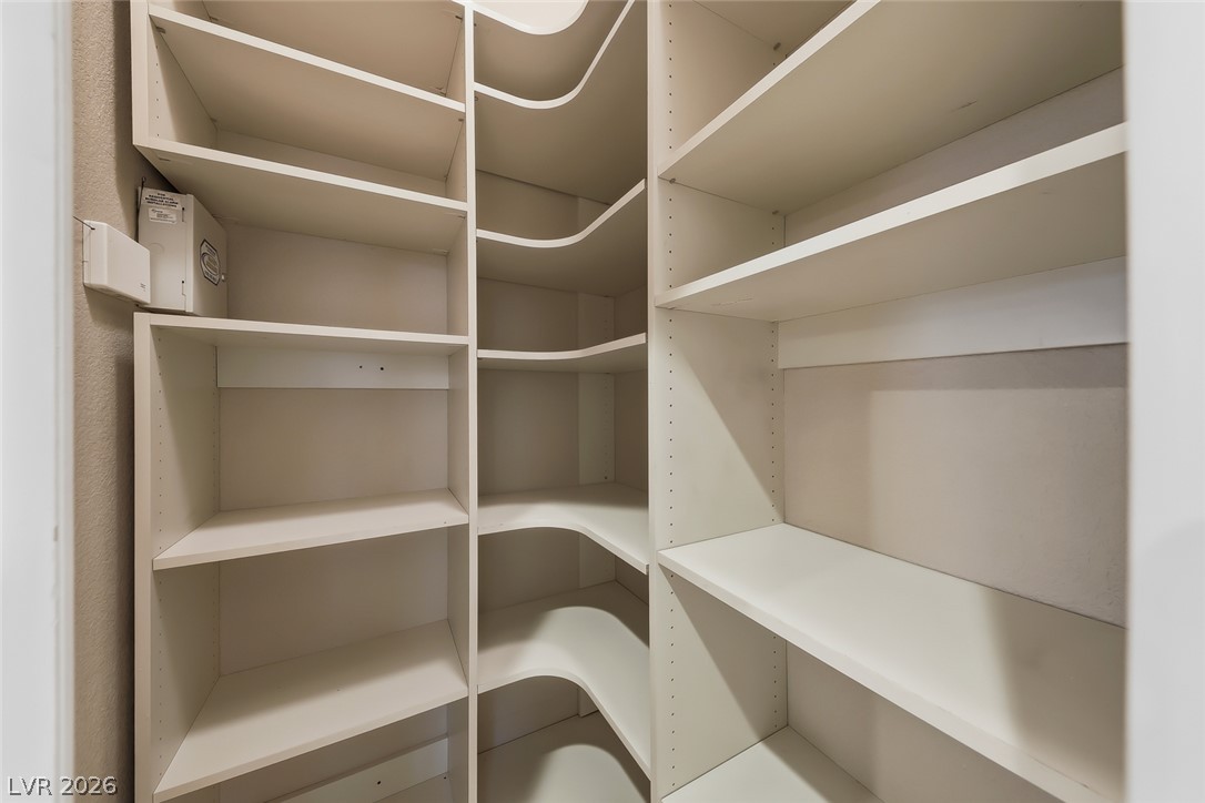 1104 Norellat Road Henderson, NV 89011 - Photo 19 of 52 Custom built-in shelving maximizes storage potential in this walk-in pantry.