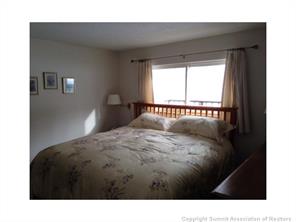 718 Deer Path Road Dillon, CO 80435 - Photo 5 of 6 a bedroom with a bed and a window