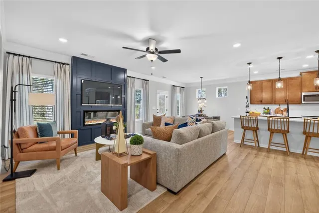 a living room with furniture and a large window