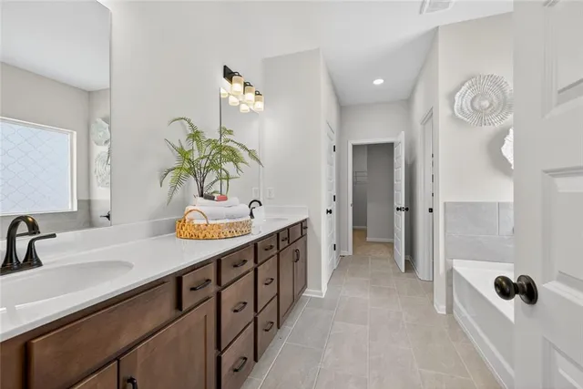 a bathroom with a sink a mirror and shower