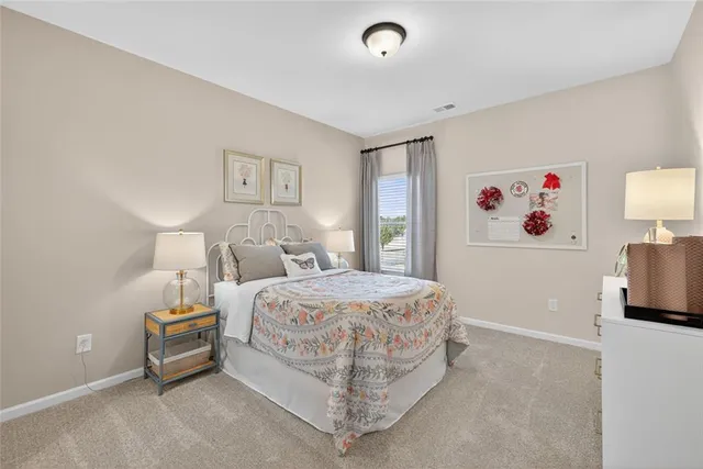 a bedroom with a bed and a tv