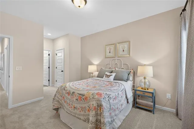 a bedroom with a bed and a lamp