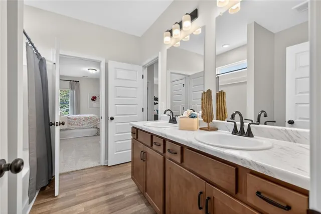 a bathroom with a sink double vanity and a mirror