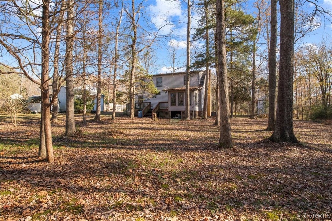 11124 Alanthus Road Midlothian, VA 23112 - Photo 28 of 28 a view of a yard with plants and trees