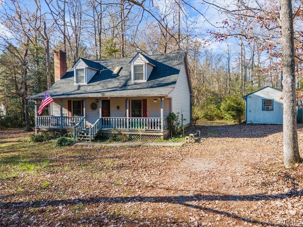 11124 Alanthus Road Midlothian, VA 23112 - Photo 3 of 28 a front view of a house with a yard and garage