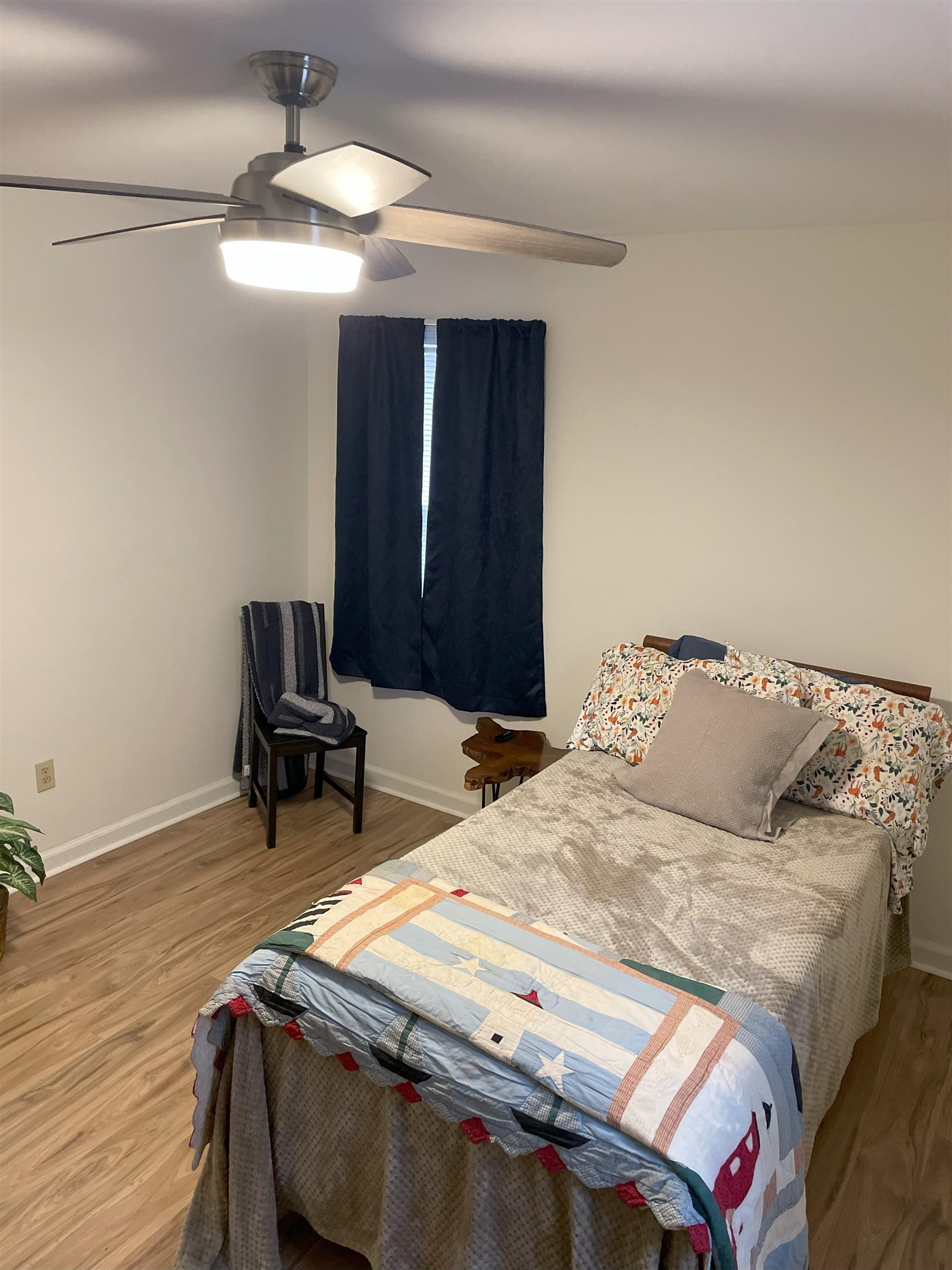 3007 Walnut Grove Road, Unit 1 Memphis, TN 38111 - Photo 12 of 14 a bedroom with a bed and a chair