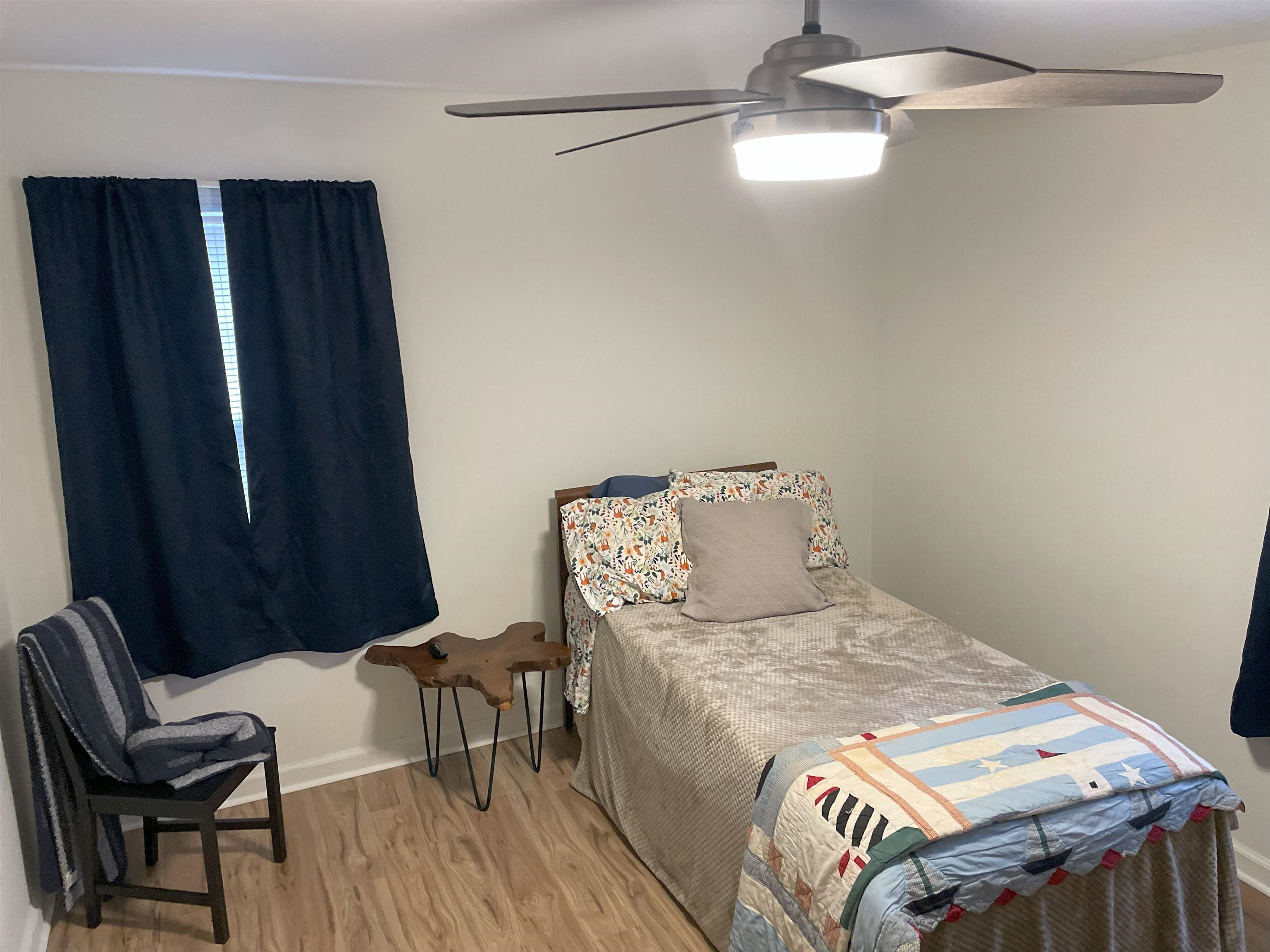 3007 Walnut Grove Road, Unit 1 Memphis, TN 38111 - Photo 13 of 14 a bed sitting in a bedroom next to a window