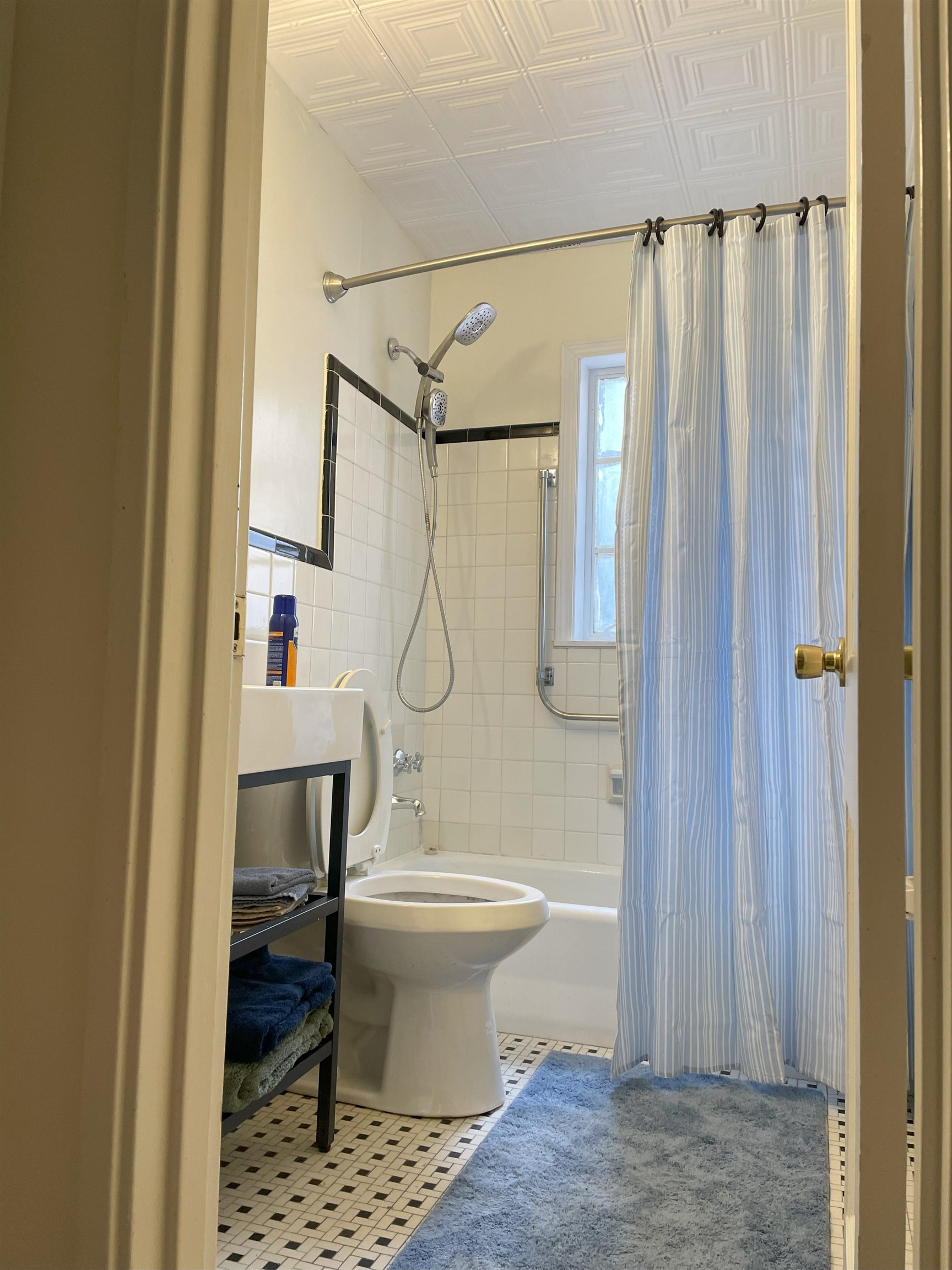 3007 Walnut Grove Road, Unit 1 Memphis, TN 38111 - Photo 9 of 14 a bathroom with a shower toilet and sink