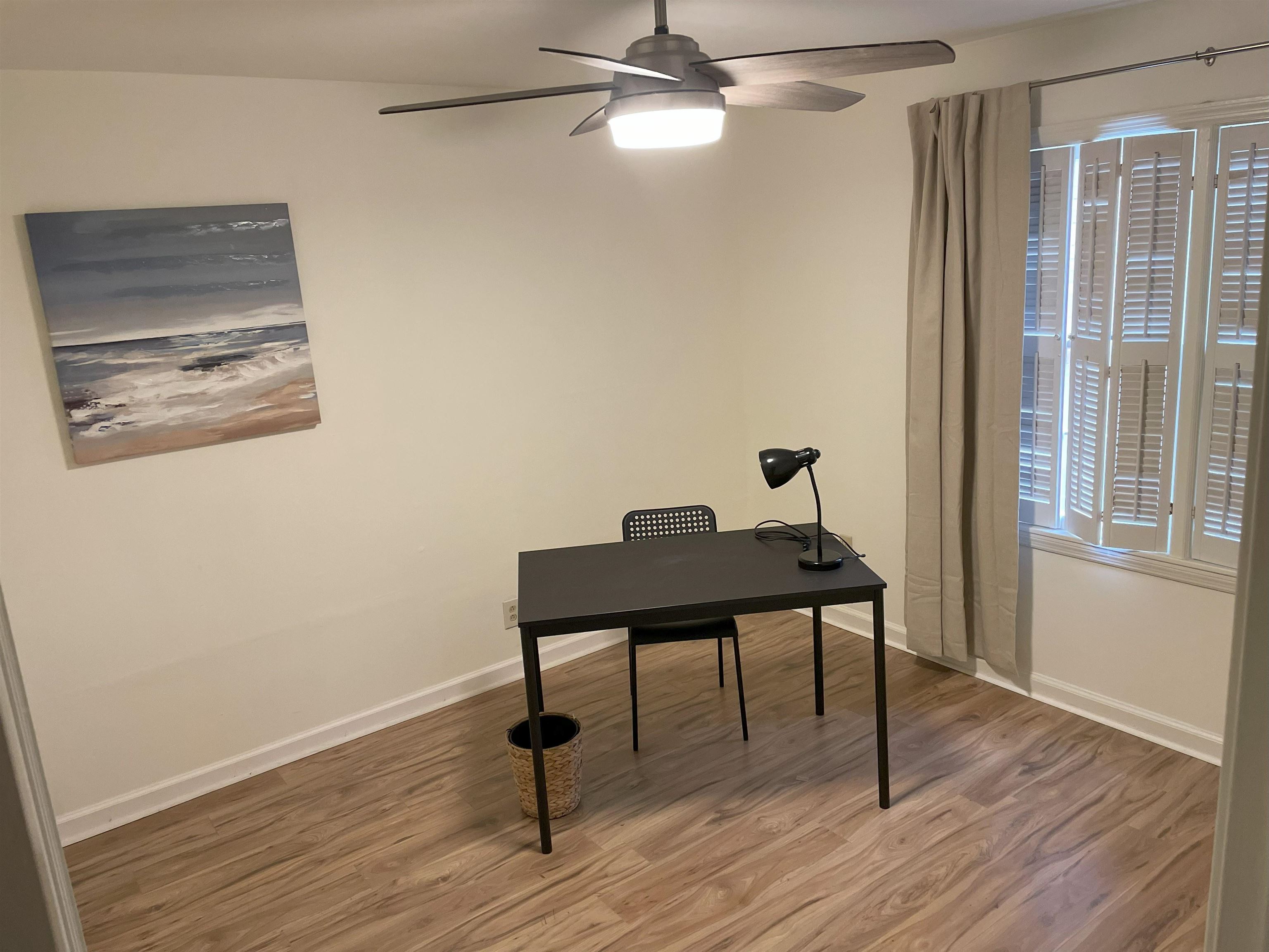 3007 Walnut Grove Road, Unit 1 Memphis, TN 38111 - Photo 10 of 14 a view of a workspace with furniture and wooden floor