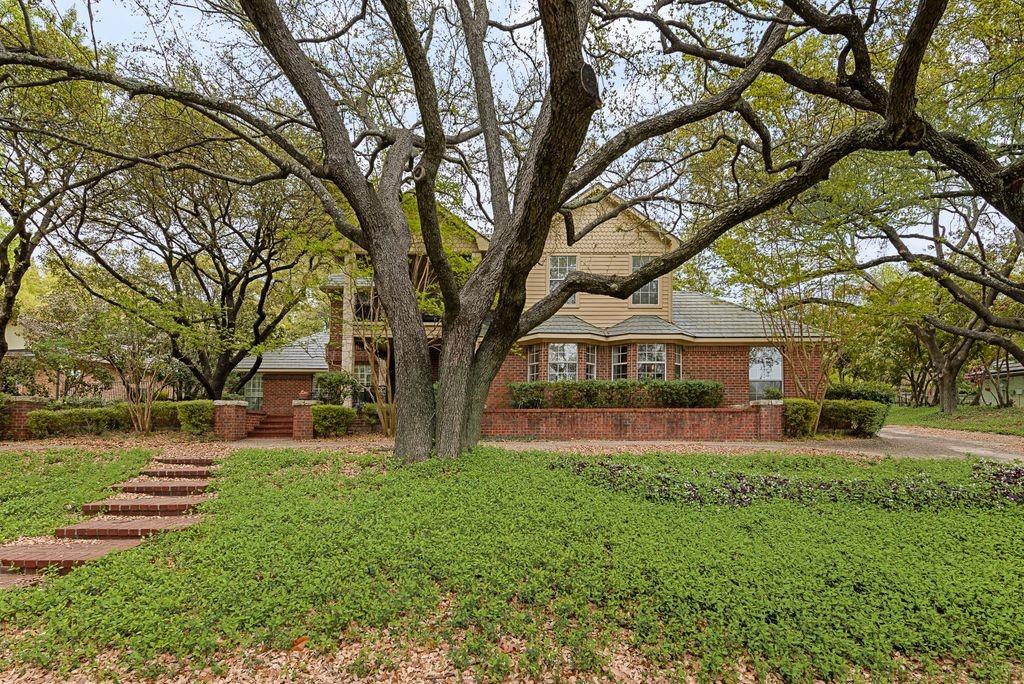 Brick facade with decorative banding and bay window