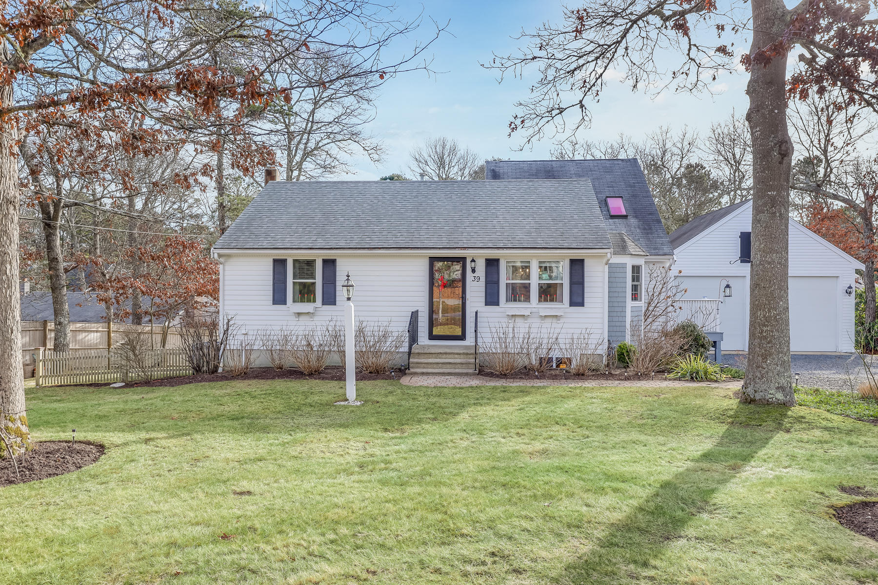39 Nobska Road Mashpee, MA 02649 - Photo 2 of 33 a house that has a tree in front of it