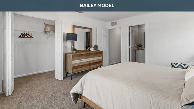 a bedroom with a bed and a desk