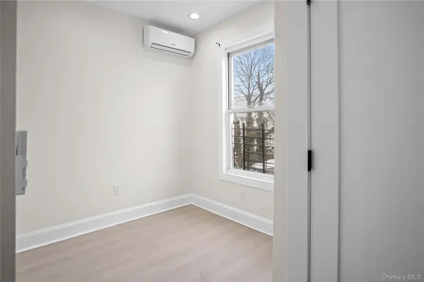 a kitchen with stainless steel appliances white cabinets and a refrigerator