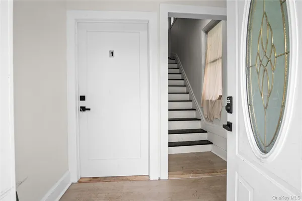 a view of a utility room with stairs