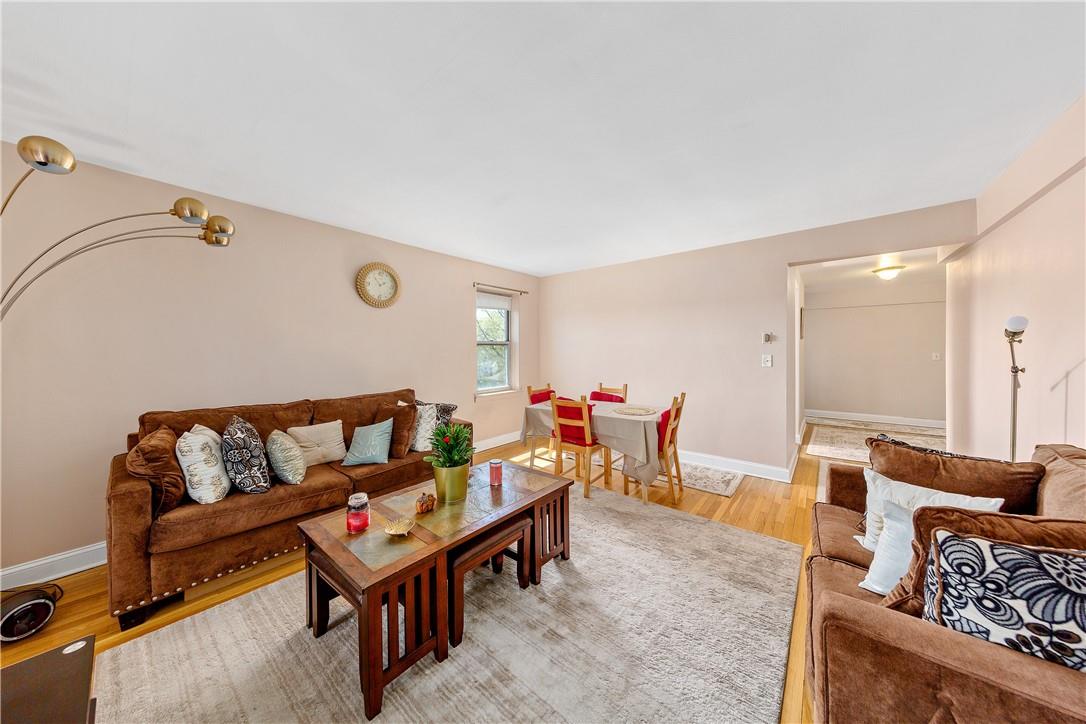 245 Bronx River Road, Unit 7F Yonkers, NY 10704 - Photo 1 of 1 a living room with furniture and a couch