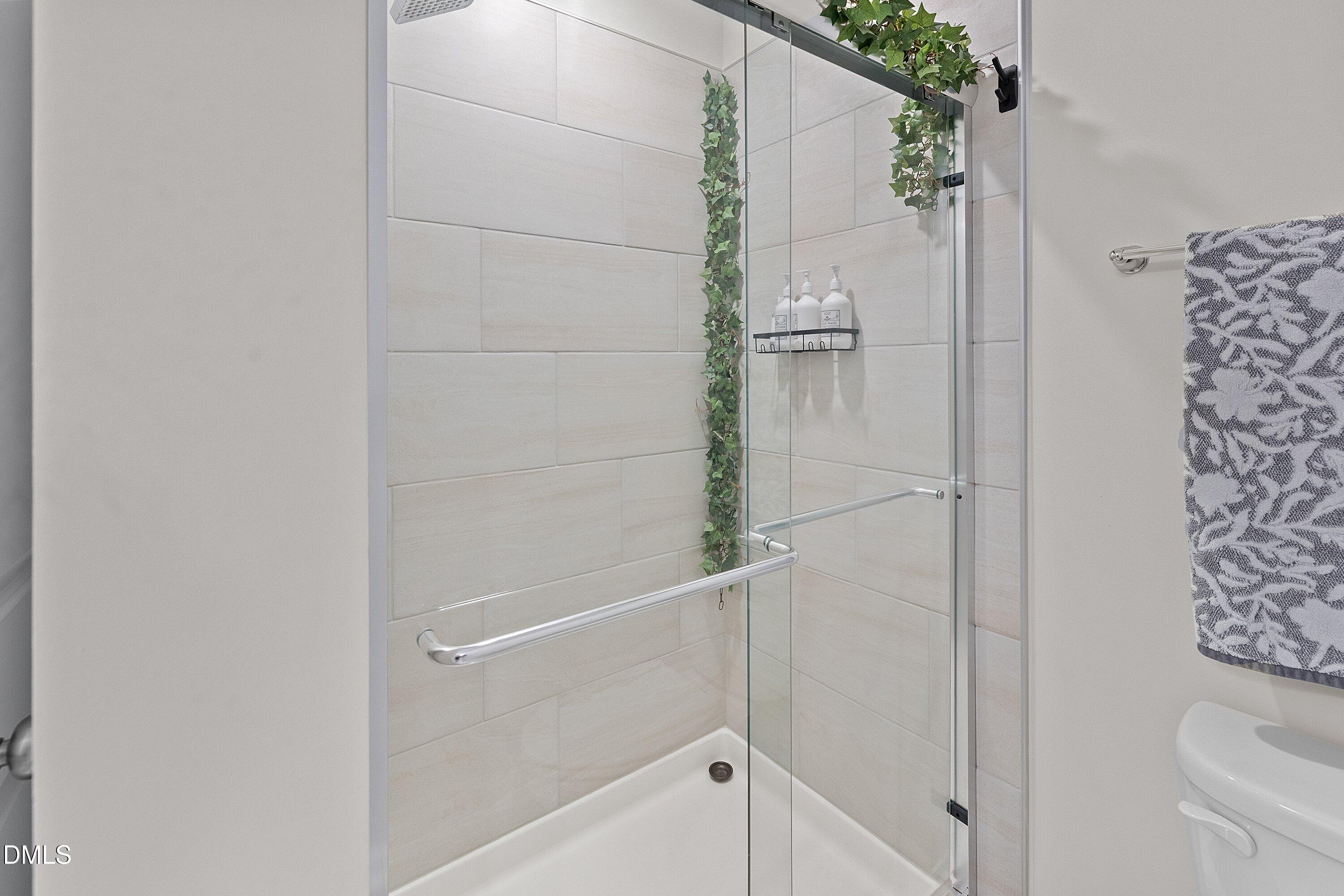 4949 Microcline Trail Raleigh, NC 27610 - Photo 13 of 42 a bathroom with a shower