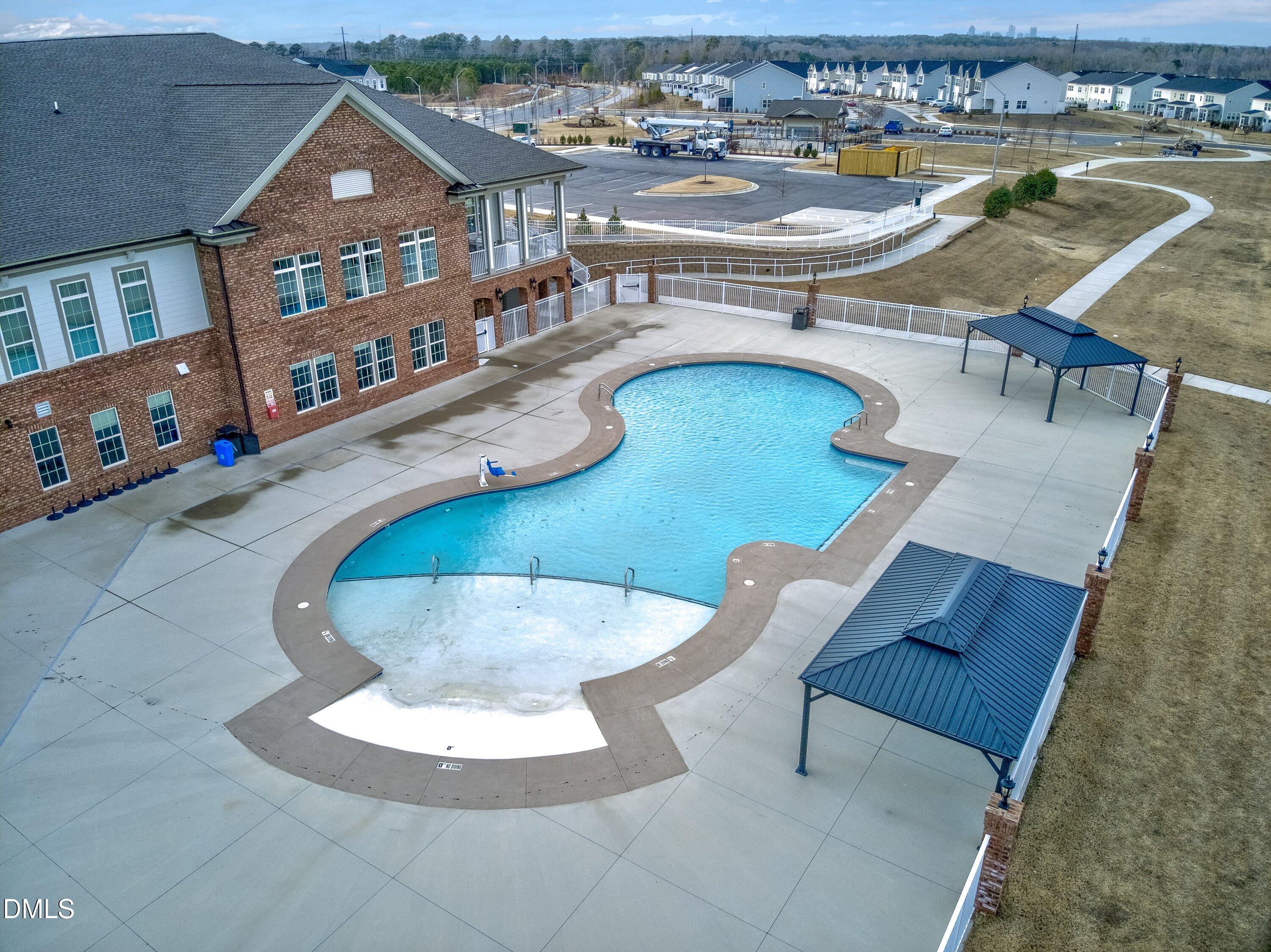 4949 Microcline Trail Raleigh, NC 27610 - Photo 17 of 42 an aerial view of a house with swimming pool patio and outdoor seating