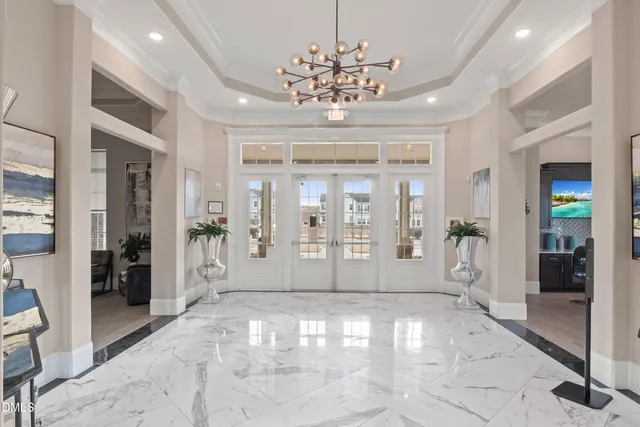 an aerial view of a house with a swimming pool