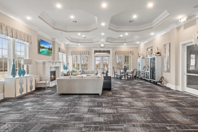 a view of a swimming pool with outdoor seating and city view