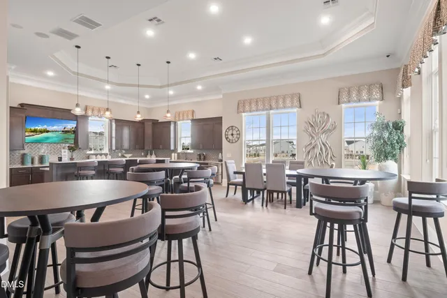 a view of a living room hardwood floor and furniture