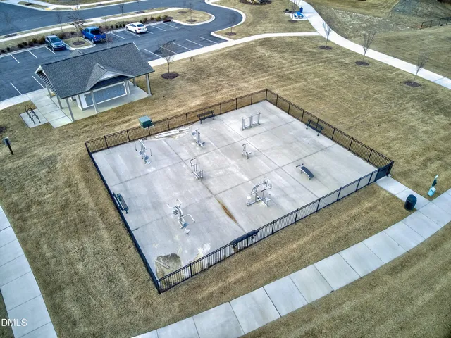 a kitchen with kitchen island a counter top space a sink and stainless steel appliances