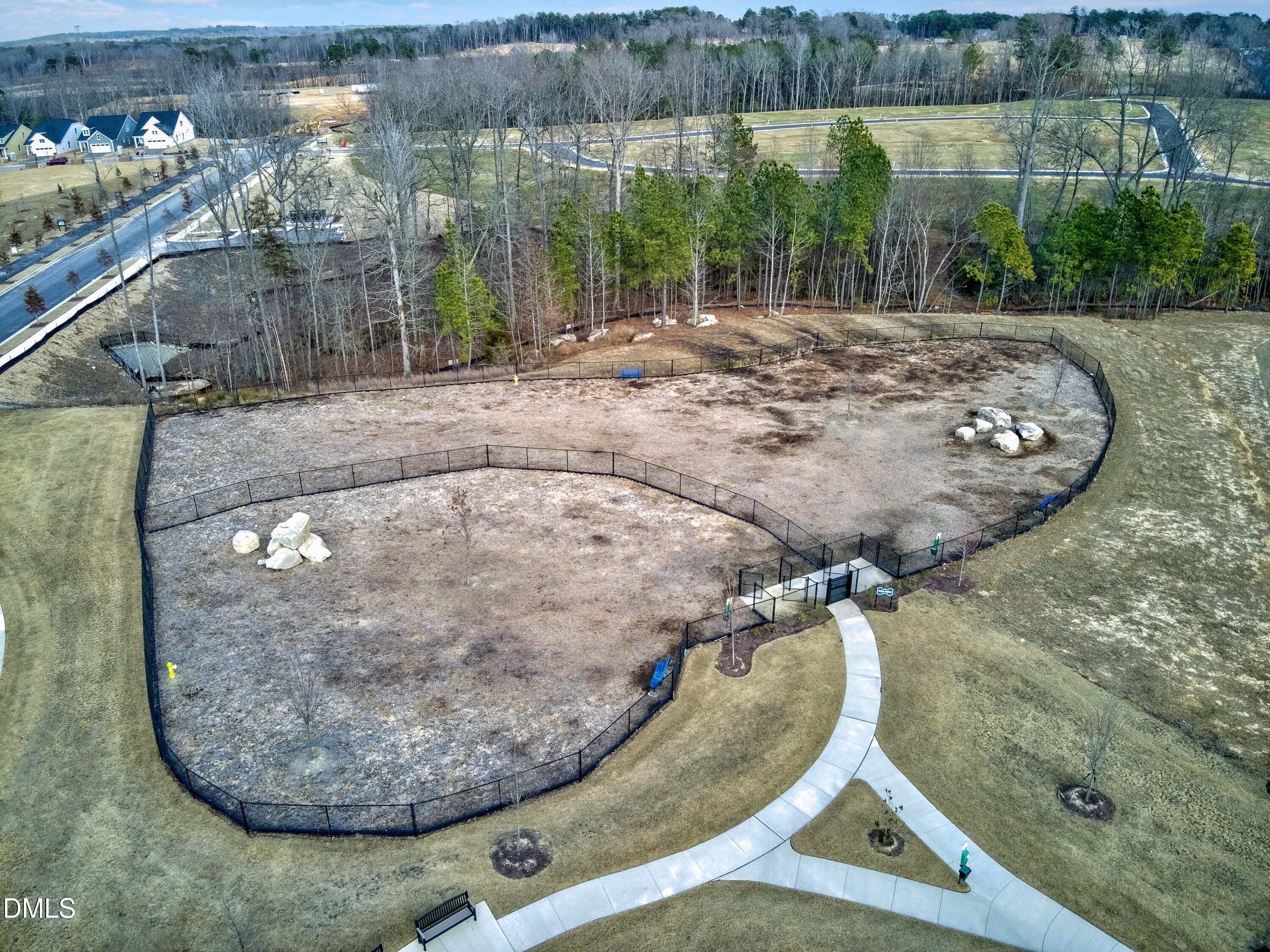 4949 Microcline Trail Raleigh, NC 27610 - Photo 32 of 42 a view of a swimming pool with a yard from a sink