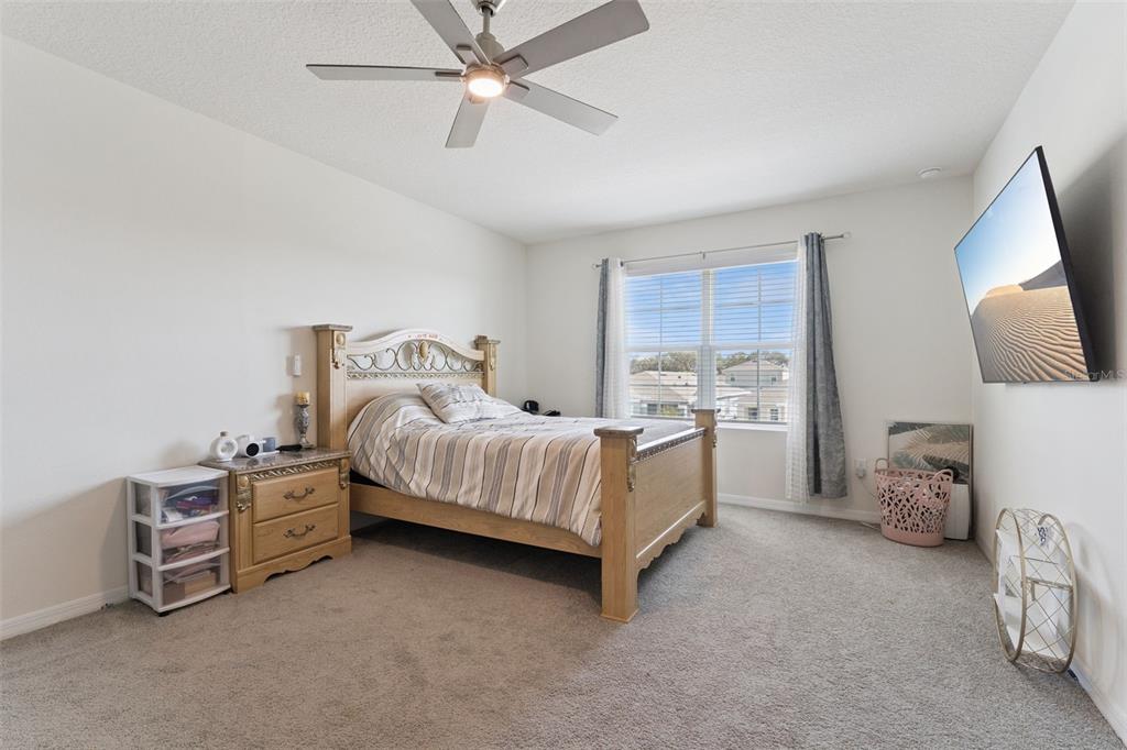 1502 Bitteroot Street Kissimmee, FL 34744 - Photo 12 of 29 a bed room with a bed and a window