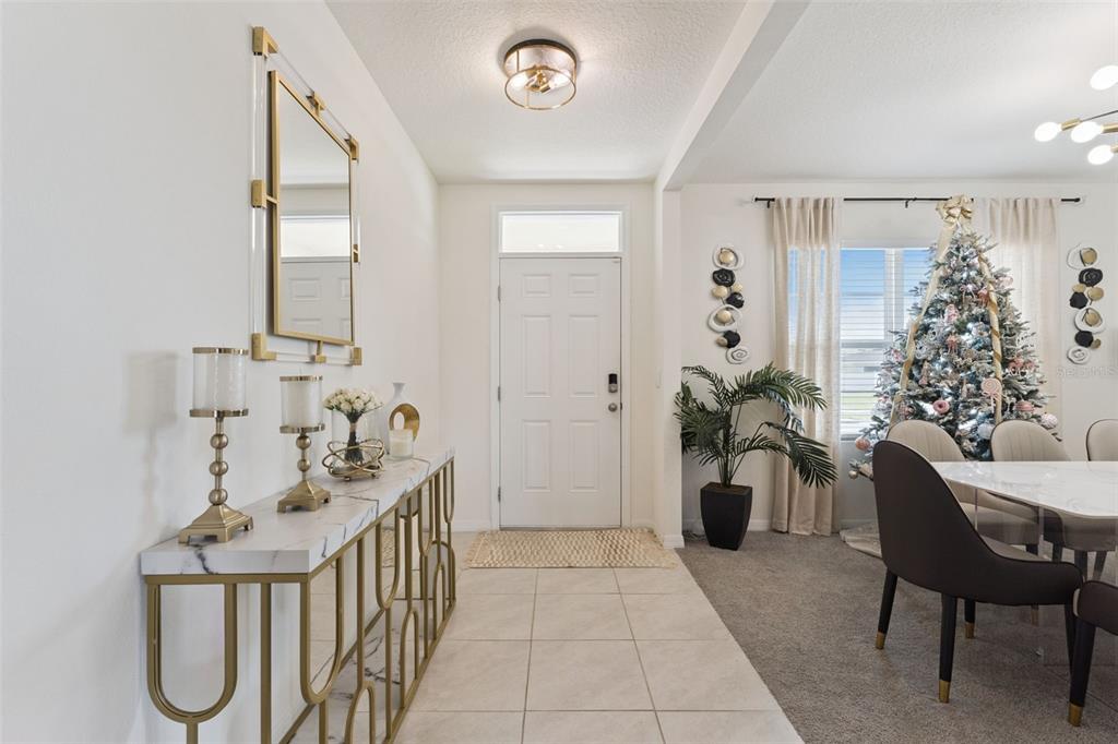 1502 Bitteroot Street Kissimmee, FL 34744 - Photo 2 of 29 a balcony with furniture and flowers