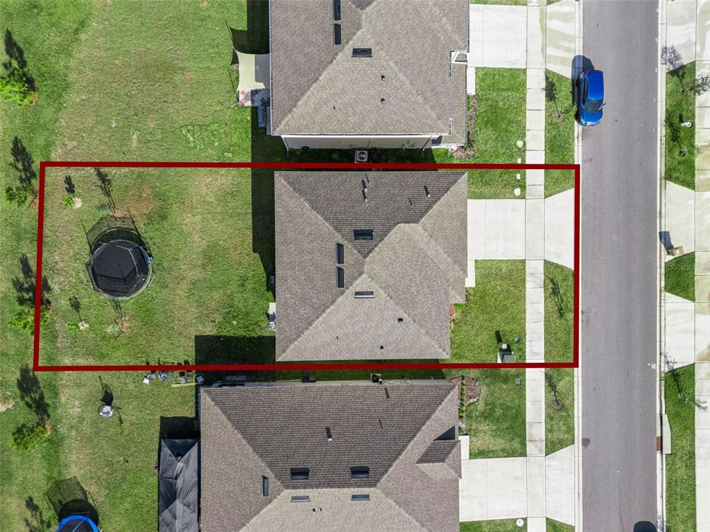 1502 Bitteroot Street Kissimmee, FL 34744 - Photo 27 of 29 an aerial view of a house with a yard