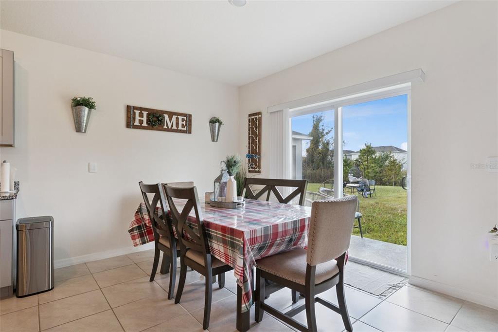 1502 Bitteroot Street Kissimmee, FL 34744 - Photo 6 of 29 a view of a dining room with furniture window and outside view