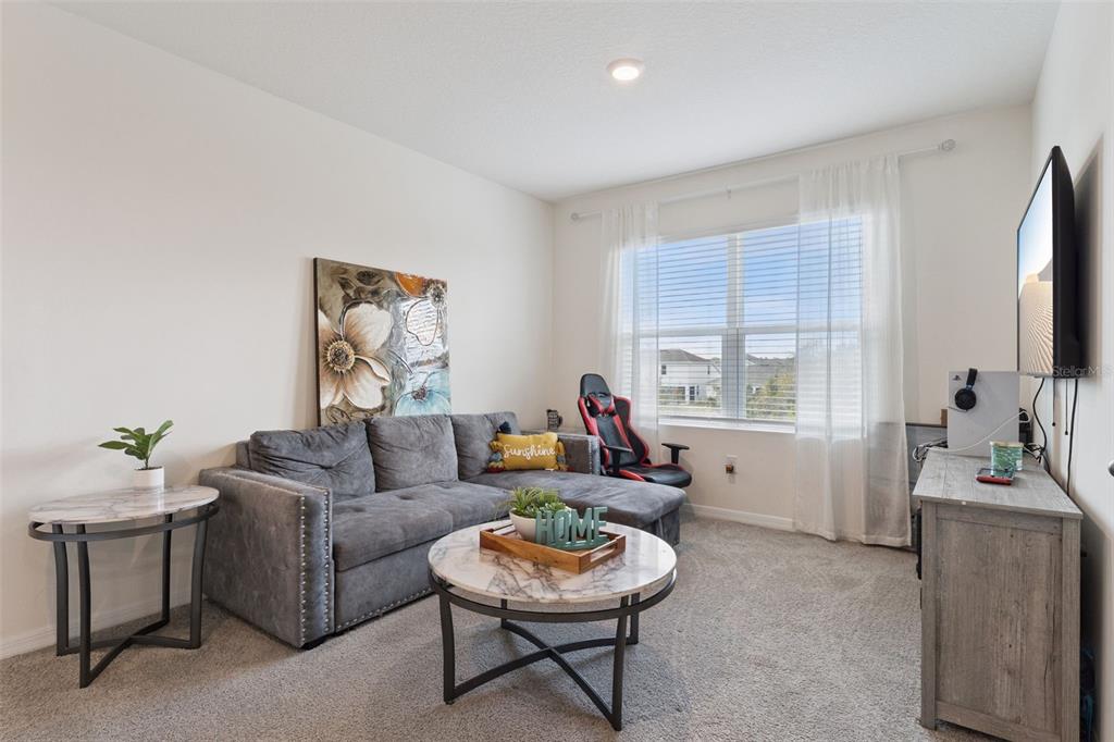 1502 Bitteroot Street Kissimmee, FL 34744 - Photo 10 of 29 a living room with furniture and a large window