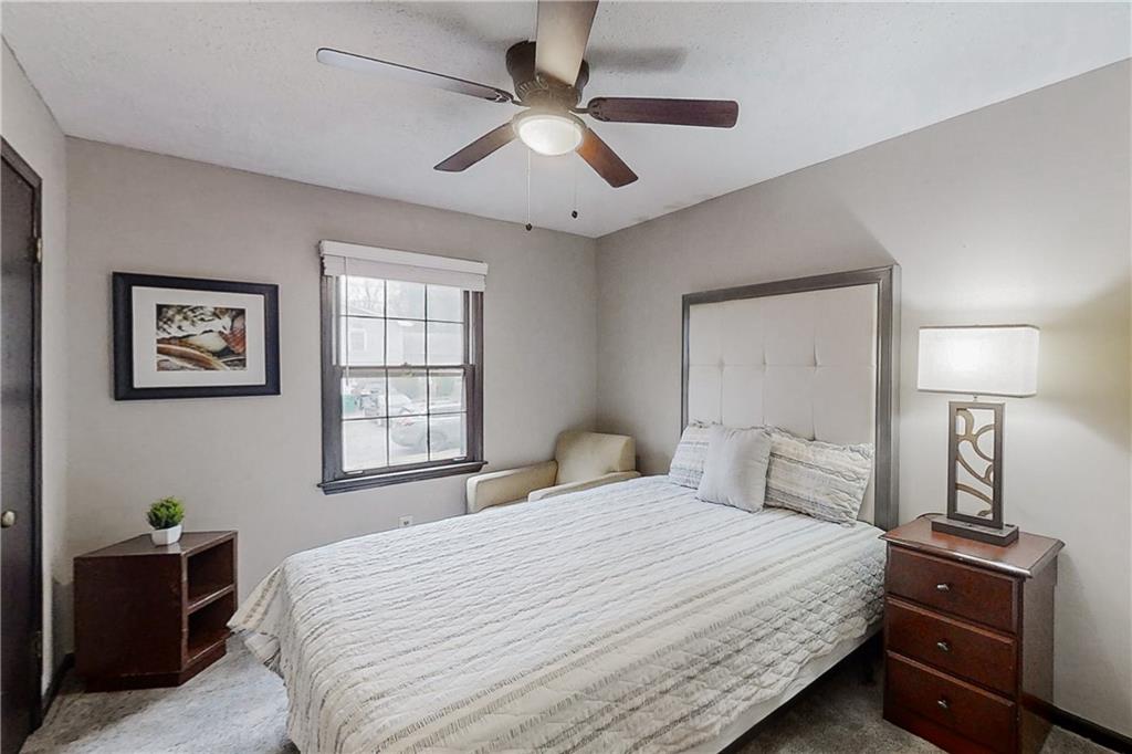 2284 Emerald Springs Drive Decatur, GA 30035 - Photo 13 of 30 a bedroom with a bed and a lamp