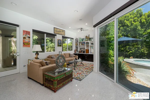 a living room with furniture and a rug