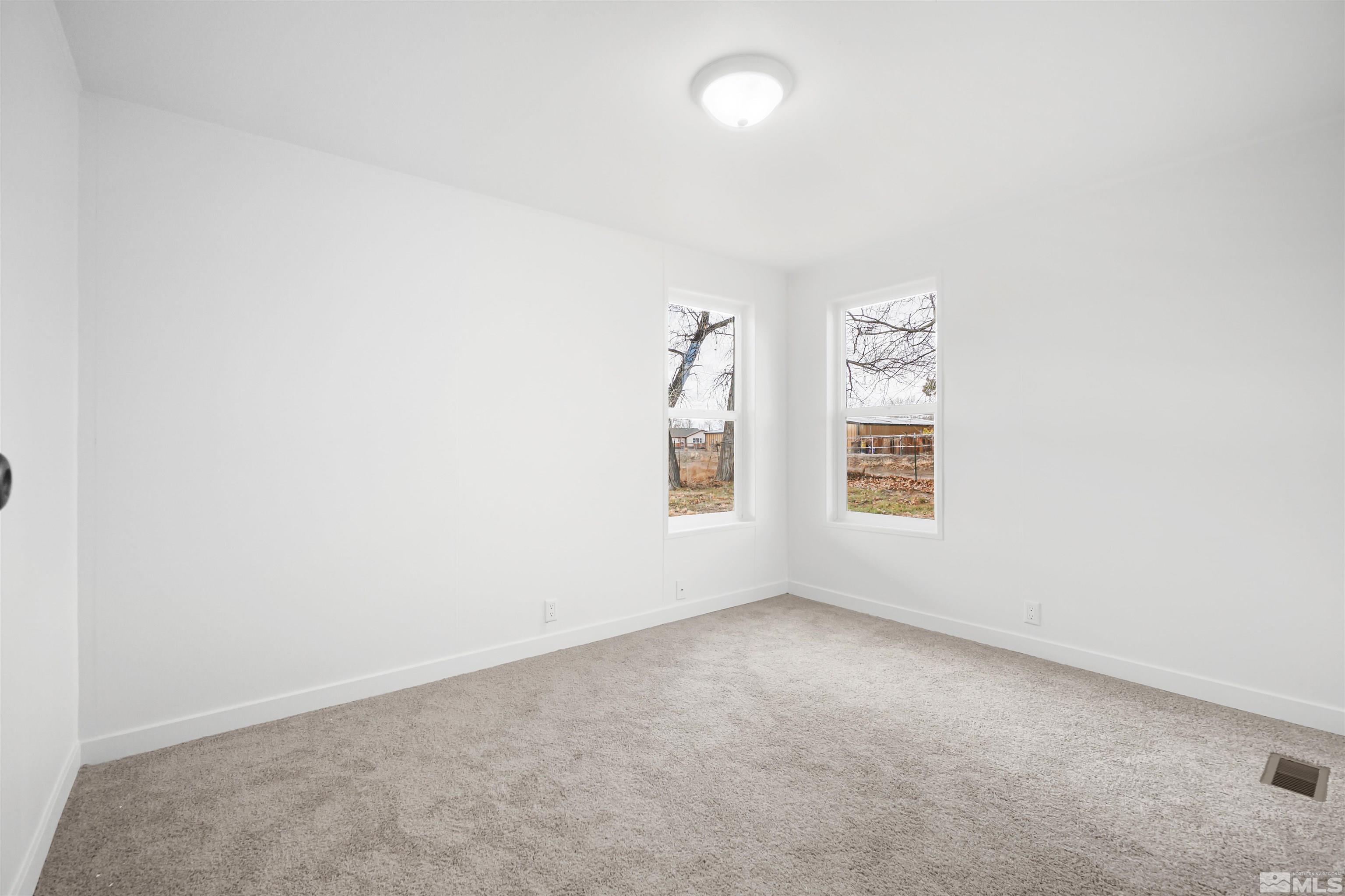 3975 Alcorn Road Fallon, NV 89406 - Photo 13 of 21 an empty room with windows