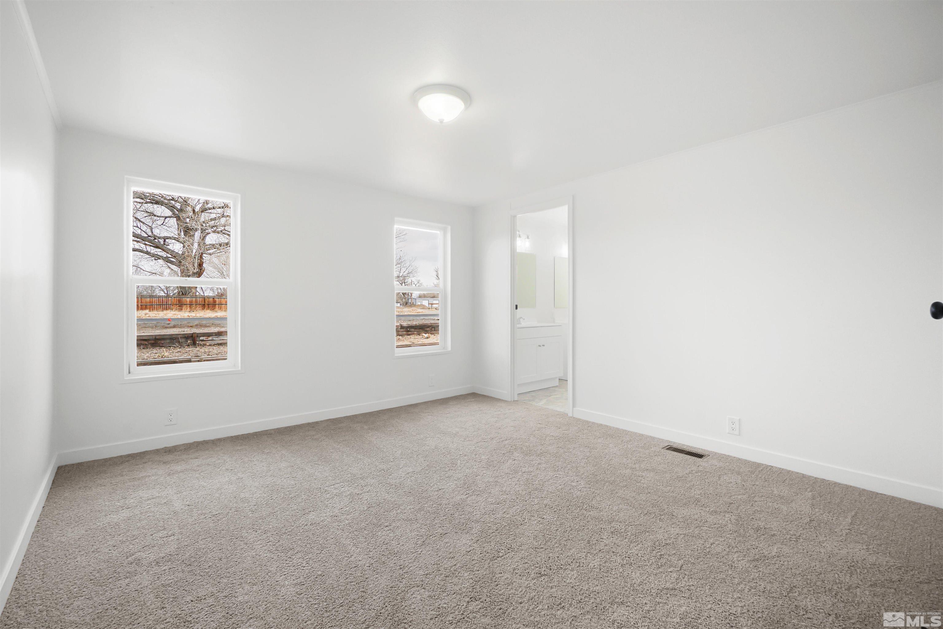 3975 Alcorn Road Fallon, NV 89406 - Photo 15 of 21 an empty room with windows