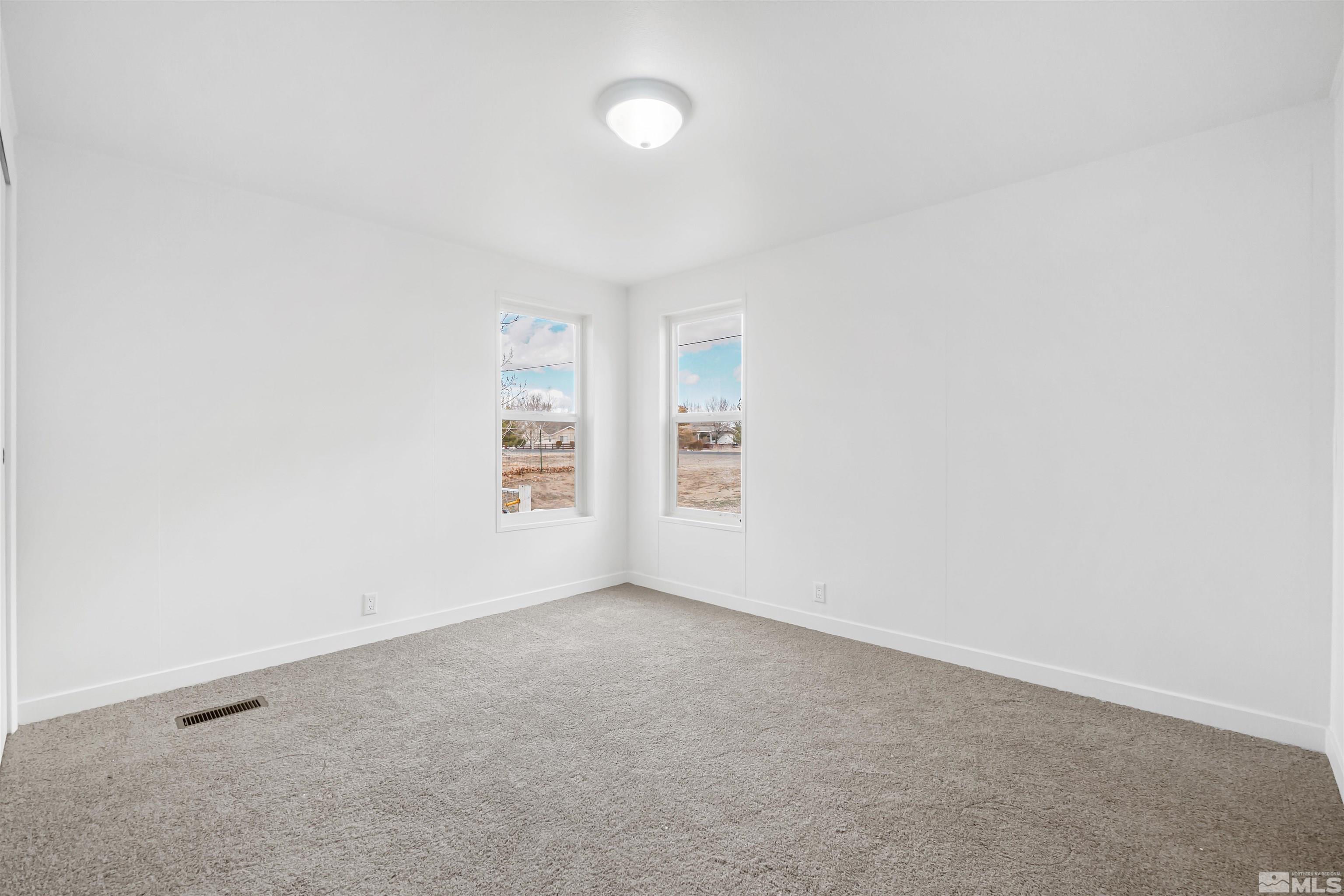 3975 Alcorn Road Fallon, NV 89406 - Photo 17 of 21 an empty room with windows