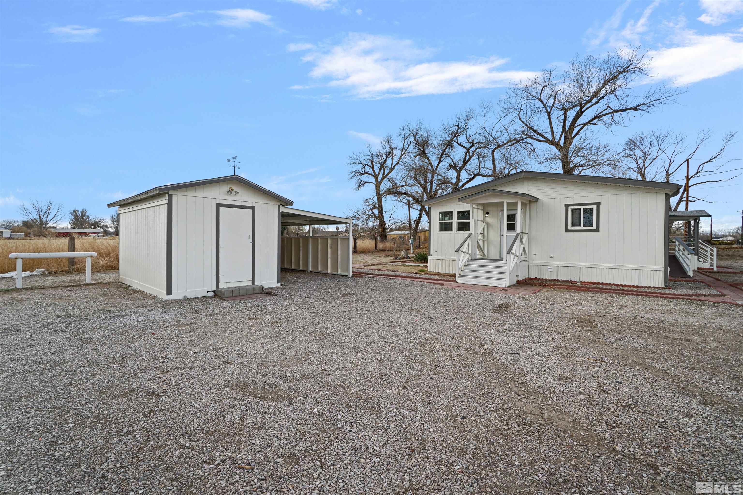 3975 Alcorn Road Fallon, NV 89406 - Photo 3 of 21 a view of a house with a backyard
