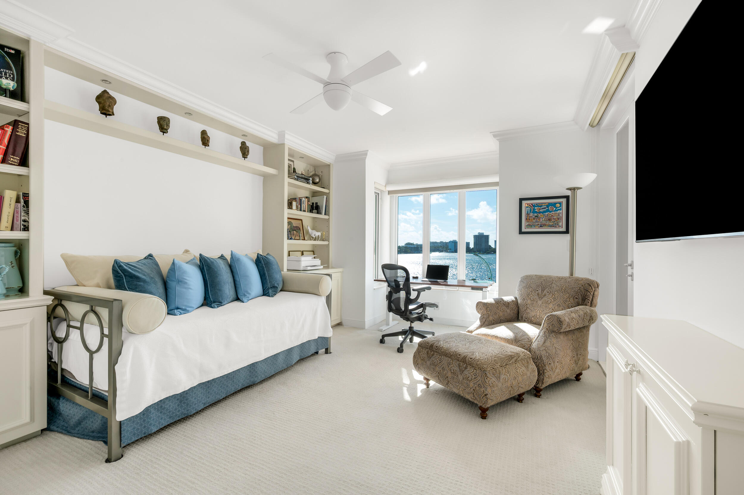 140 Southeast 5th Avenue, Unit PH50 Boca Raton, FL 33432 - Photo 12 of 52 a bedroom with furniture and a flat screen tv