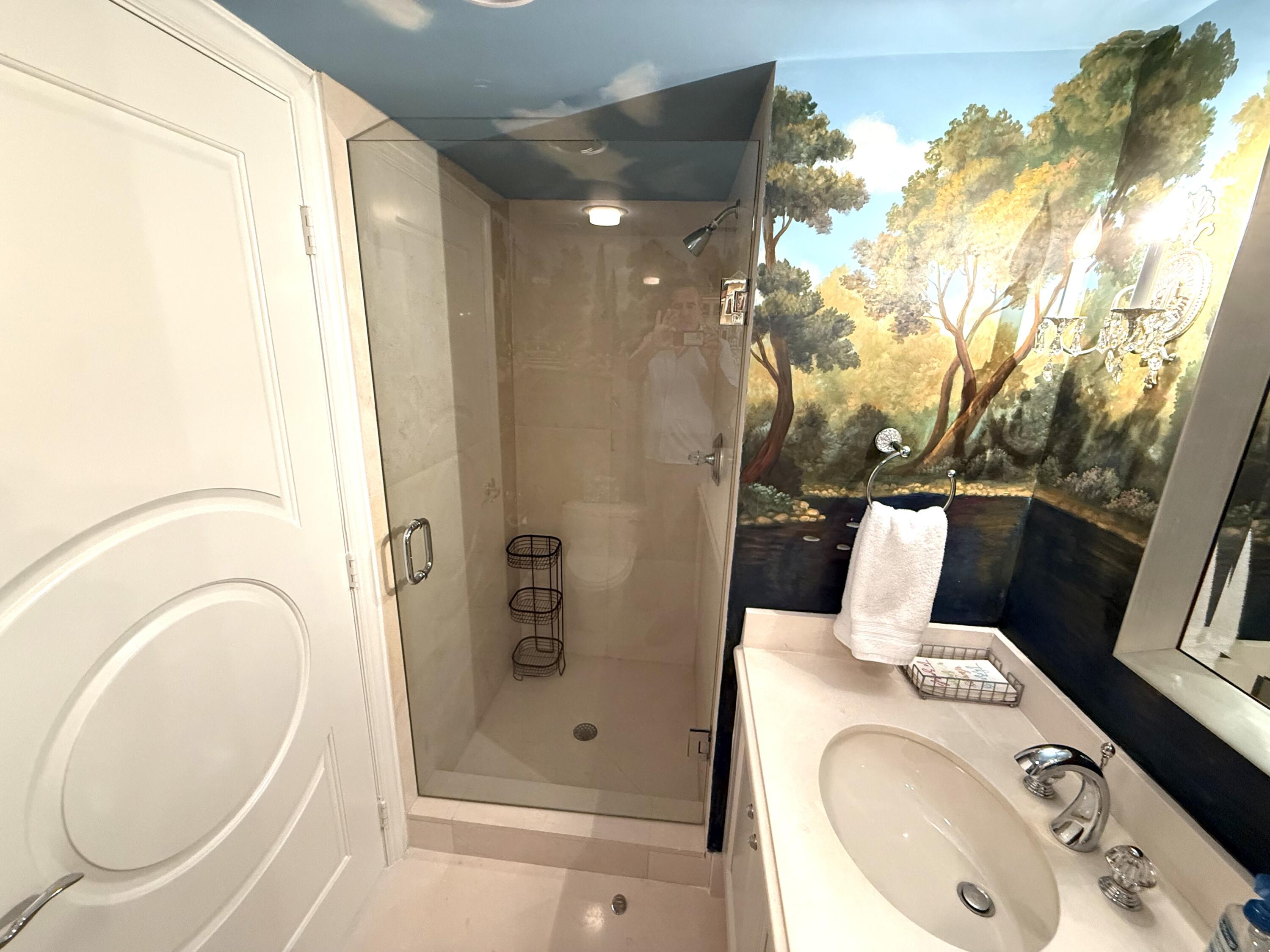 140 Southeast 5th Avenue, Unit PH50 Boca Raton, FL 33432 - Photo 14 of 52 a bathroom with a sink and a mirror