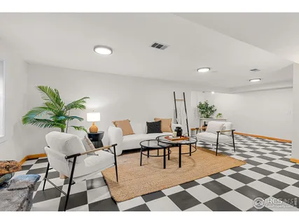 a living room with furniture and a rug