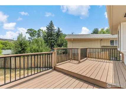 a view of balcony with wooden floor
