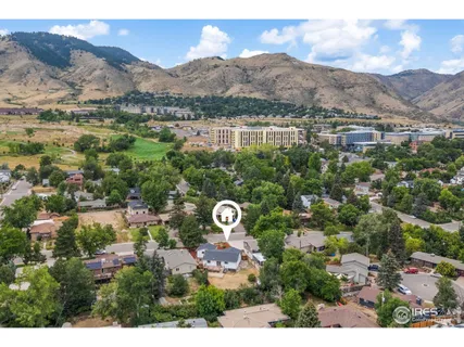 a view of a city with mountains in the background